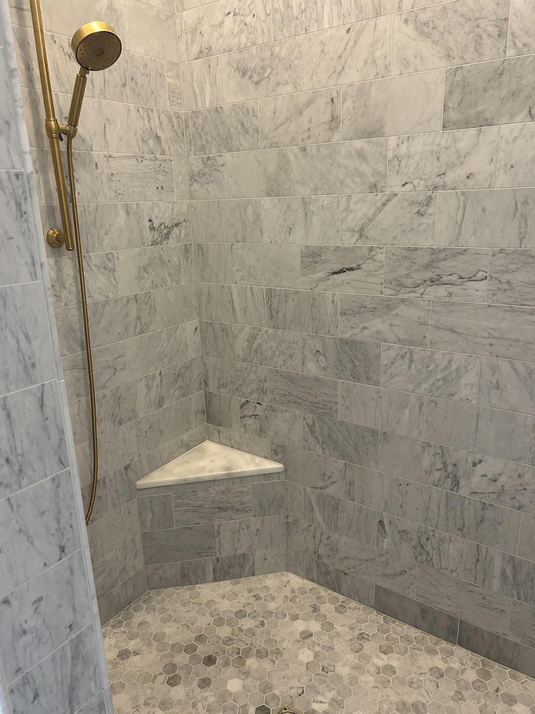 Polished Marble Tiles with Hexagonal Tile Shower